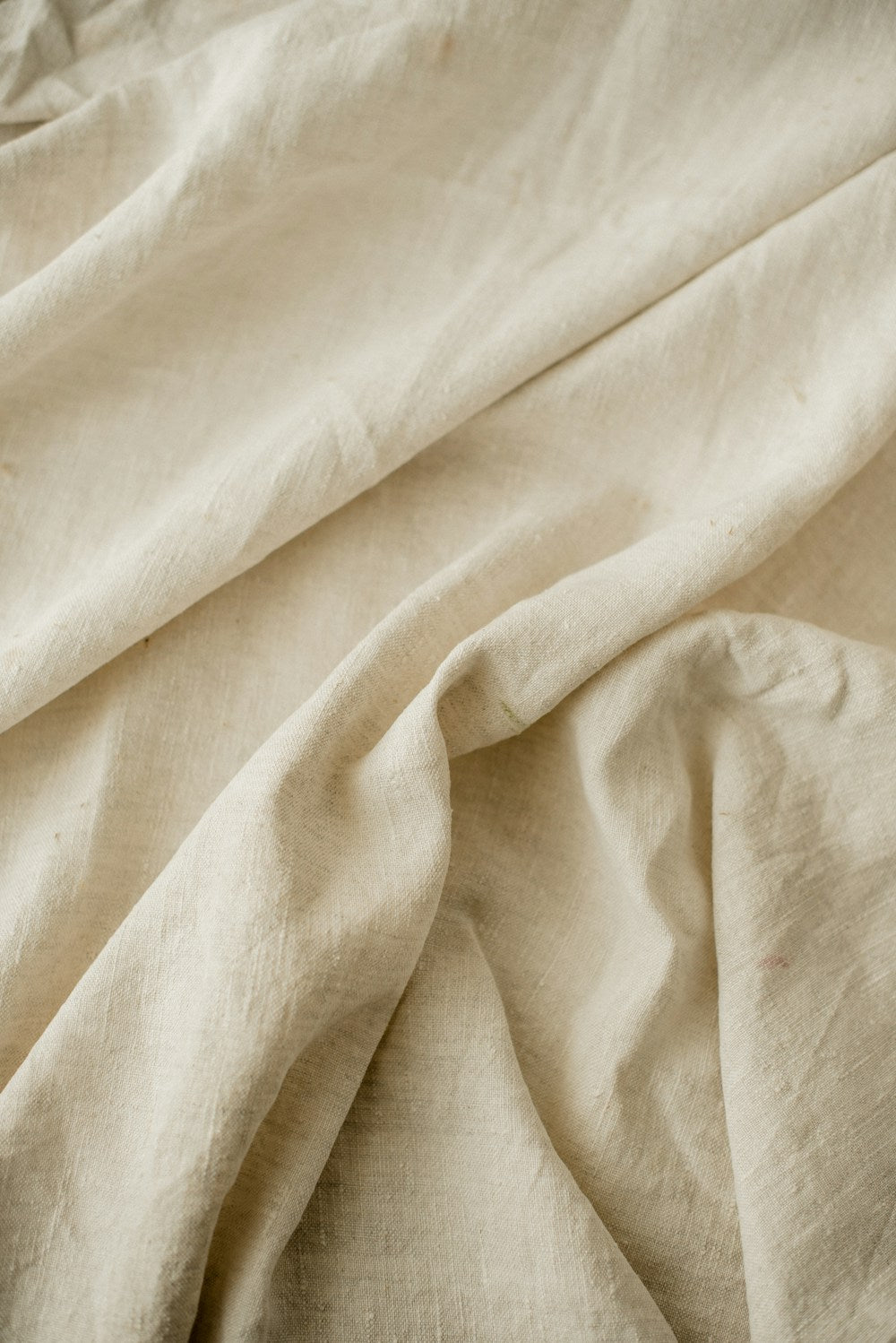 Close-up of plain white bed linen — textile reference